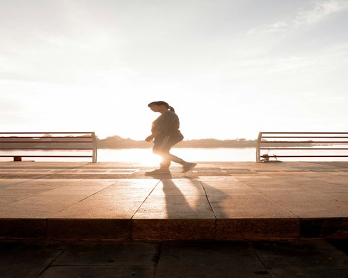 Person walking dynamically but comfortably in the morning